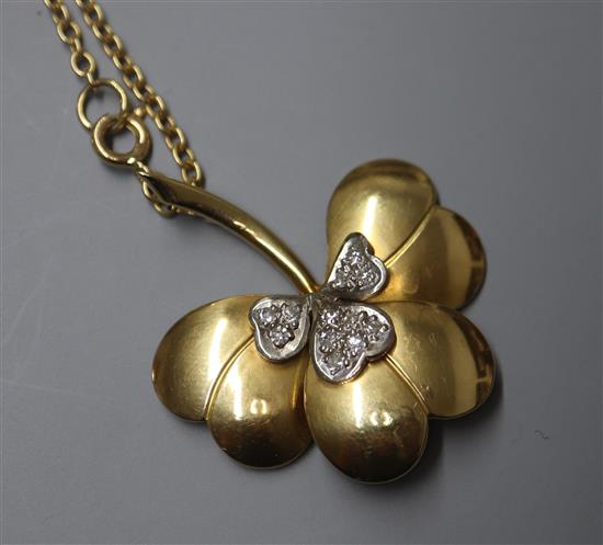 A modern 18ct gold and diamond set leaf pendant, on an 18ct gold chain, in Garrard & Co box, pendant 38mm.